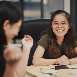 two female students laughing