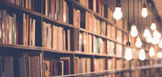 a close up of a book shelf filled with books