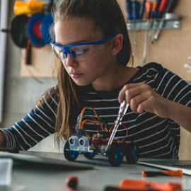 a person in glasses looking at the camera