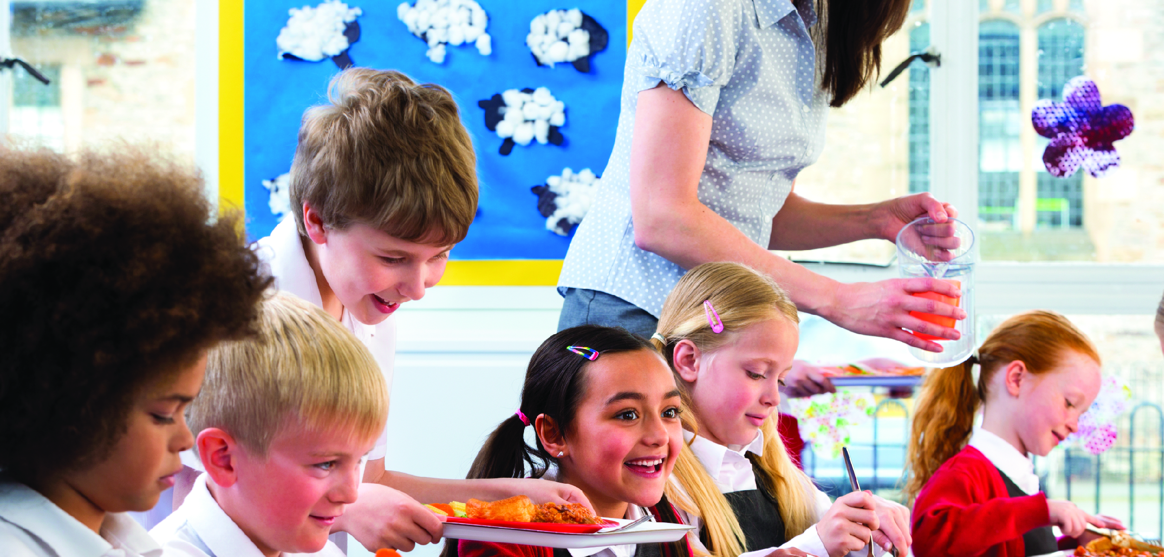 Group of school children eating