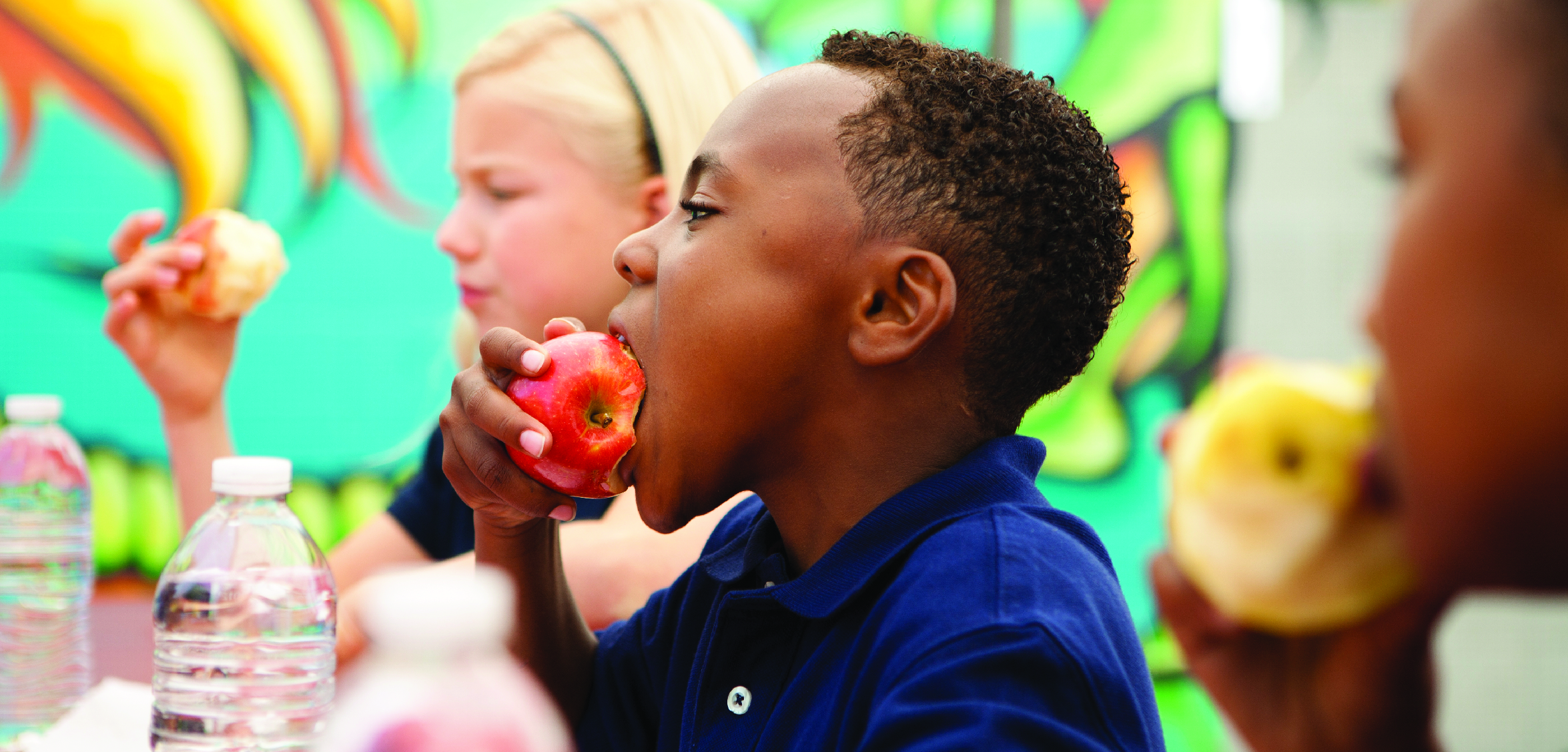 Picture of child eating an apple