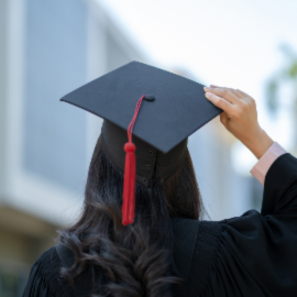 person holding graduation cap