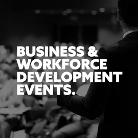 Business and workforce development events. Image of a business speaker in front of an audience.