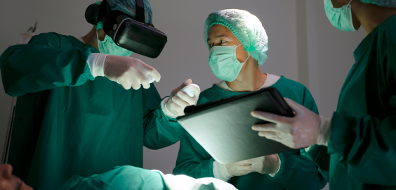 Surgeon performing surgery with VR goggles representing the future of learning 