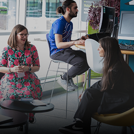 student talking to advisor in the library