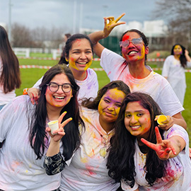 Students enjoying Holi festival celebrations