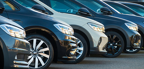 5 cars parked in a line photo taken from the side meaning only one side of the cars are visible
