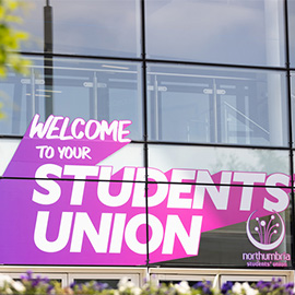 Students union logo on the front od the students union building in City campus
