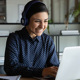 girl on laptop smiling