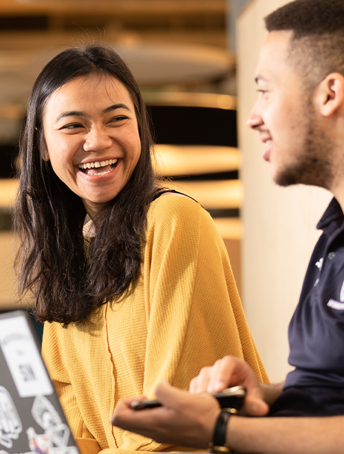 two students laughing