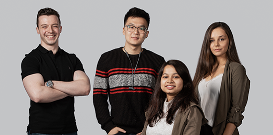 a group of people posing for the camera