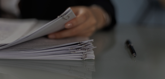 Close up of a person holding documents
