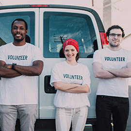 group of volunteers with arms crossed