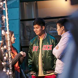 a group of people standing in front of a crowd
