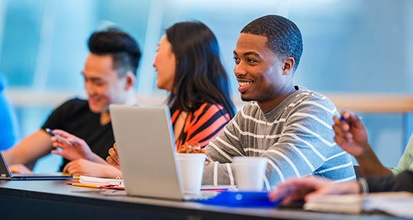 Man smiling with laptop