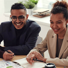 people smiling at office table