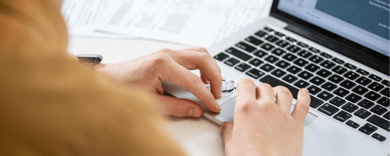close up of someone typing on a computer