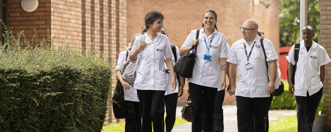 nursing students walking on coach lane campus