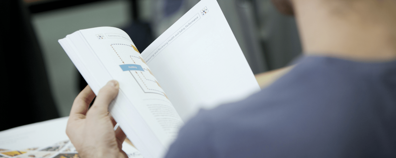 close up of student flicking through a book