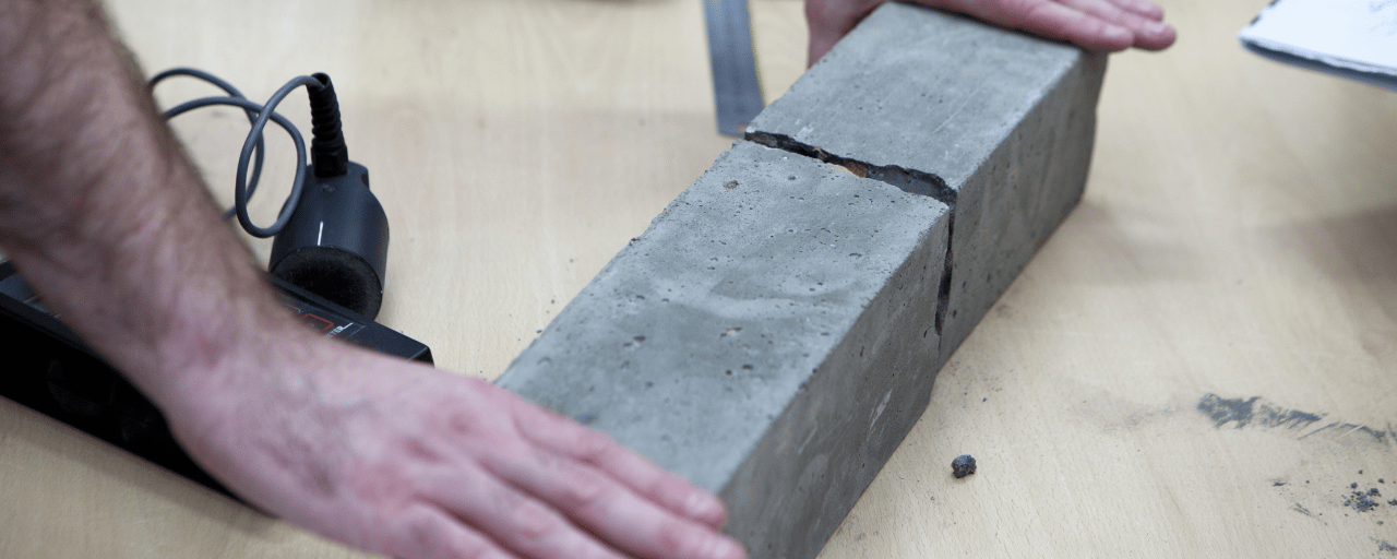 student cutting concrete