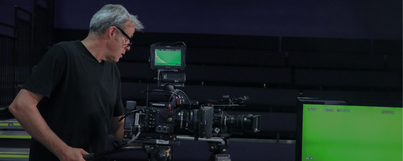 man using large tv camera