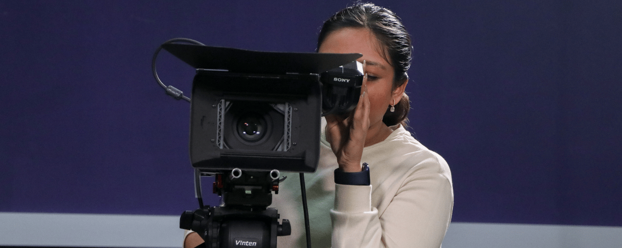 woman behind camera