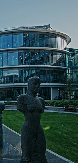 a statue in front of a building