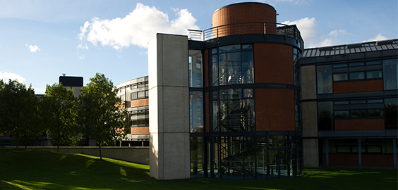 Exterior of Coach lane Campus- orange, white and black building 