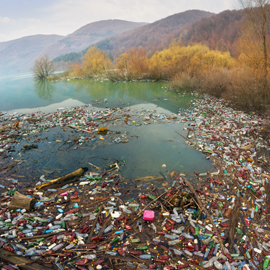 Pollution in water with mountains in background