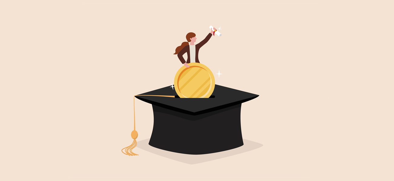 Women sitting on graduation hat with money