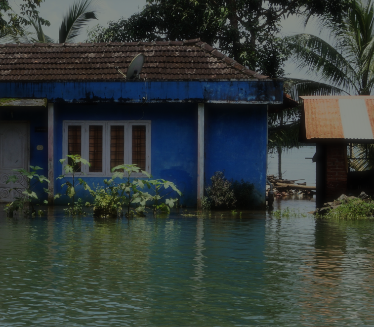 Blue house in flooded area