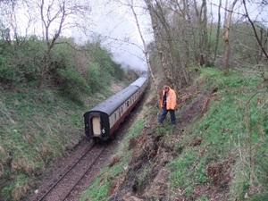 Caption: Inspecting an earth slope on the Boness and Kinneil Railway
