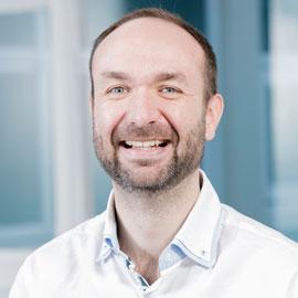 a man smiling for the camera
