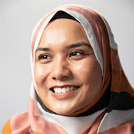 a close up of a person wearing a scarf