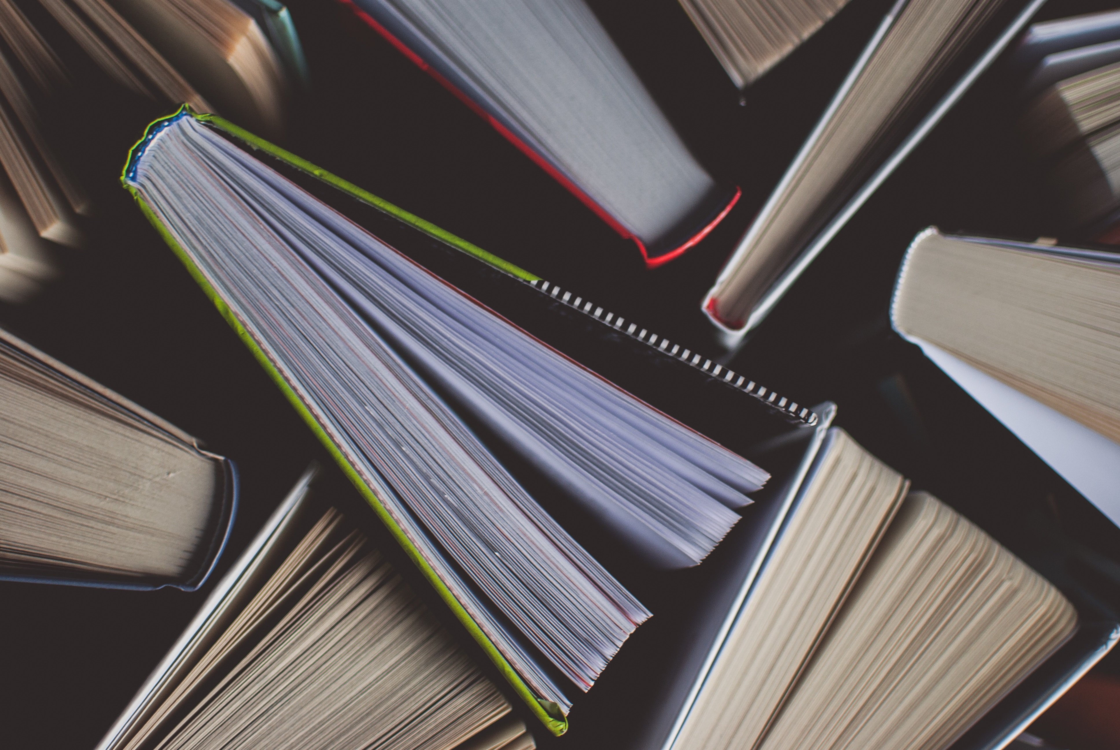 A selection of books arranged together taken from a birds eye view