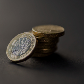 A stack of coins on a black background