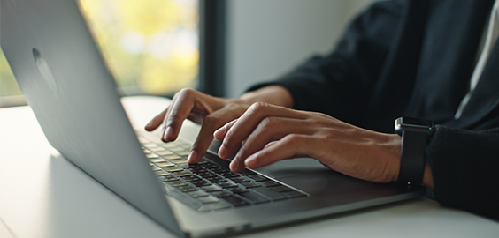 Someone typing on a keyboard