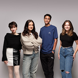 4 students photographed with a white background