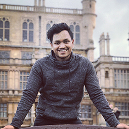 a man standing in front of a building