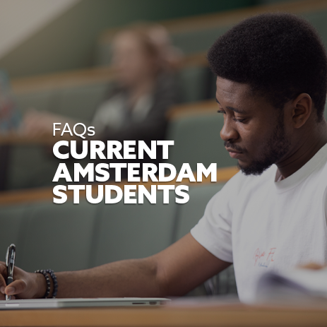 Image: close-up of a male student wearing a white t-shirt, making notes in a lecture theatre. Text: "FAQs - Current Amsterdam Students"