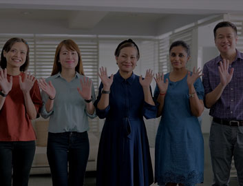 Close-up of the Malaysia Regional Office Team waving to the camera