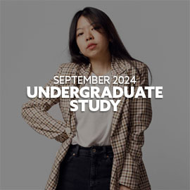 Close-up of a female, Malaysian student wearing a cream checkered jacket with white t-shirt with her hand on her hip - she is looking directly at the camera. Text is embedded on the image reading: "September 2024 Undergraduate Study"