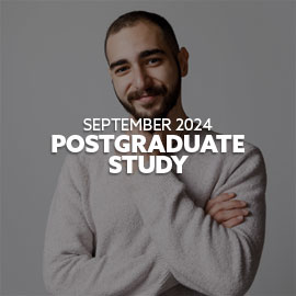 Close-up of a male, Iranian student wearing a grey long sleeved top - he is smiling with his hand on his chin and looking directly at the camera. Text is embedded on the image reading: "September 2024 Postgraduate Study"