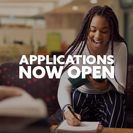 Image: Female student sat on a sofa, laughing, taking notes. Text: "Applications Now Open"