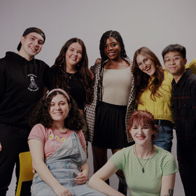 Group of Northumbria students stood, smiling.