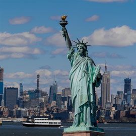 The Statue of Liberty over the scene of New York City