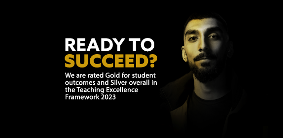 Golden light shining on a student. There is text embedded on the image reading "Ready to succeed? We are rated Gold for student outcomes and Silver overall in the Teaching Excellence Framework 2023"