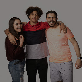 Grey background with three students