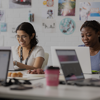 Two students using laptops