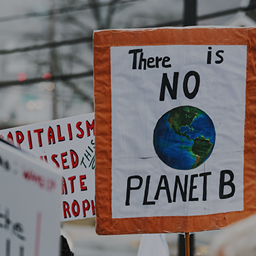 Close-up of a picket sign at a climate protest that reads "There is no Planet B"